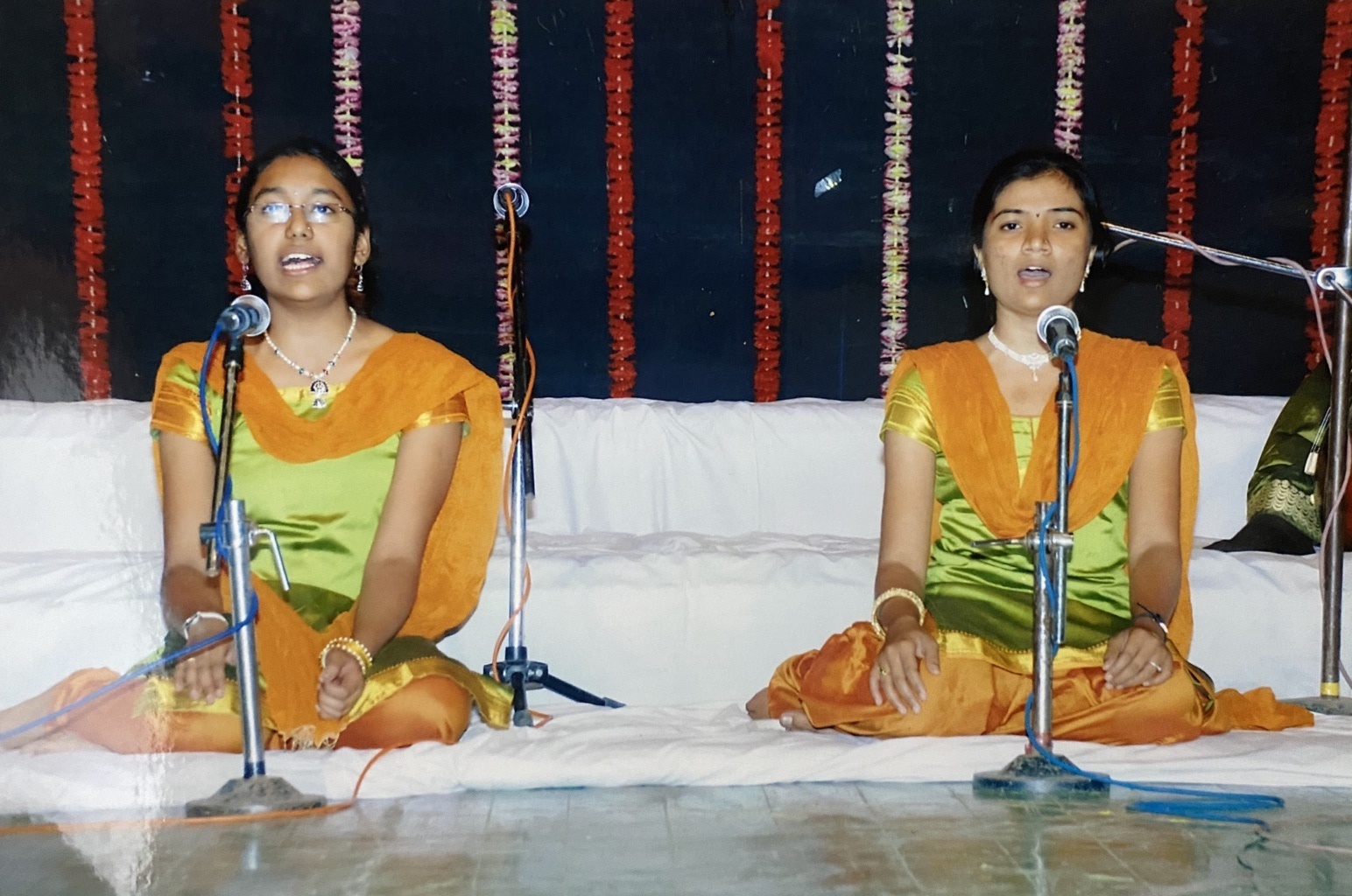Scholars, Hetal Lodha towards left and Pranjal Jadhav to right performing Tarana during the cultural meet. 